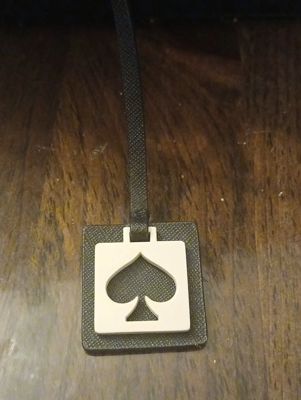Kate Spaden Black bag  Charm with  Spade Emblem Leather